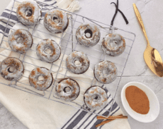 12 iced donuts on cooling rack